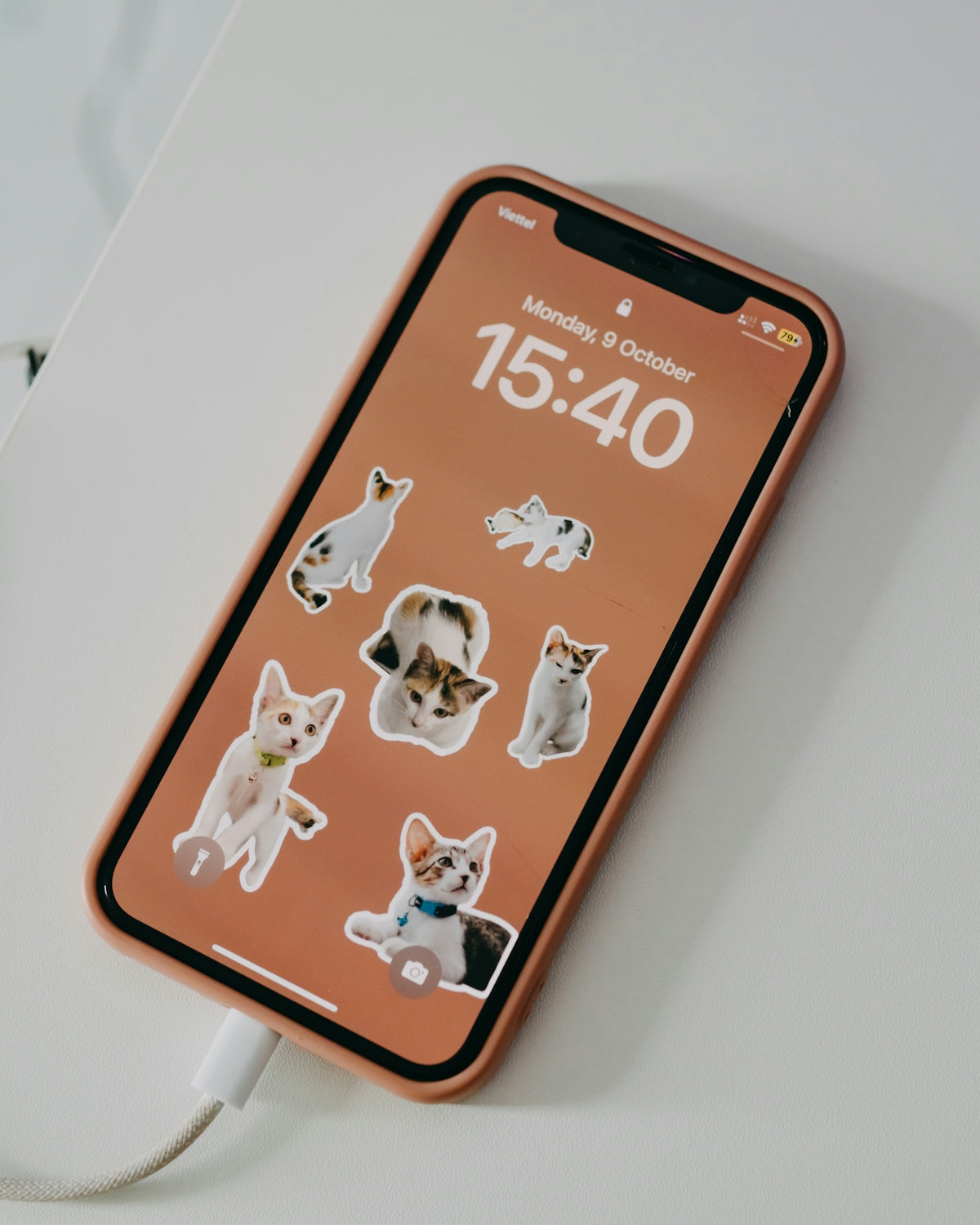 a cell phone with a bunch of stickers on it